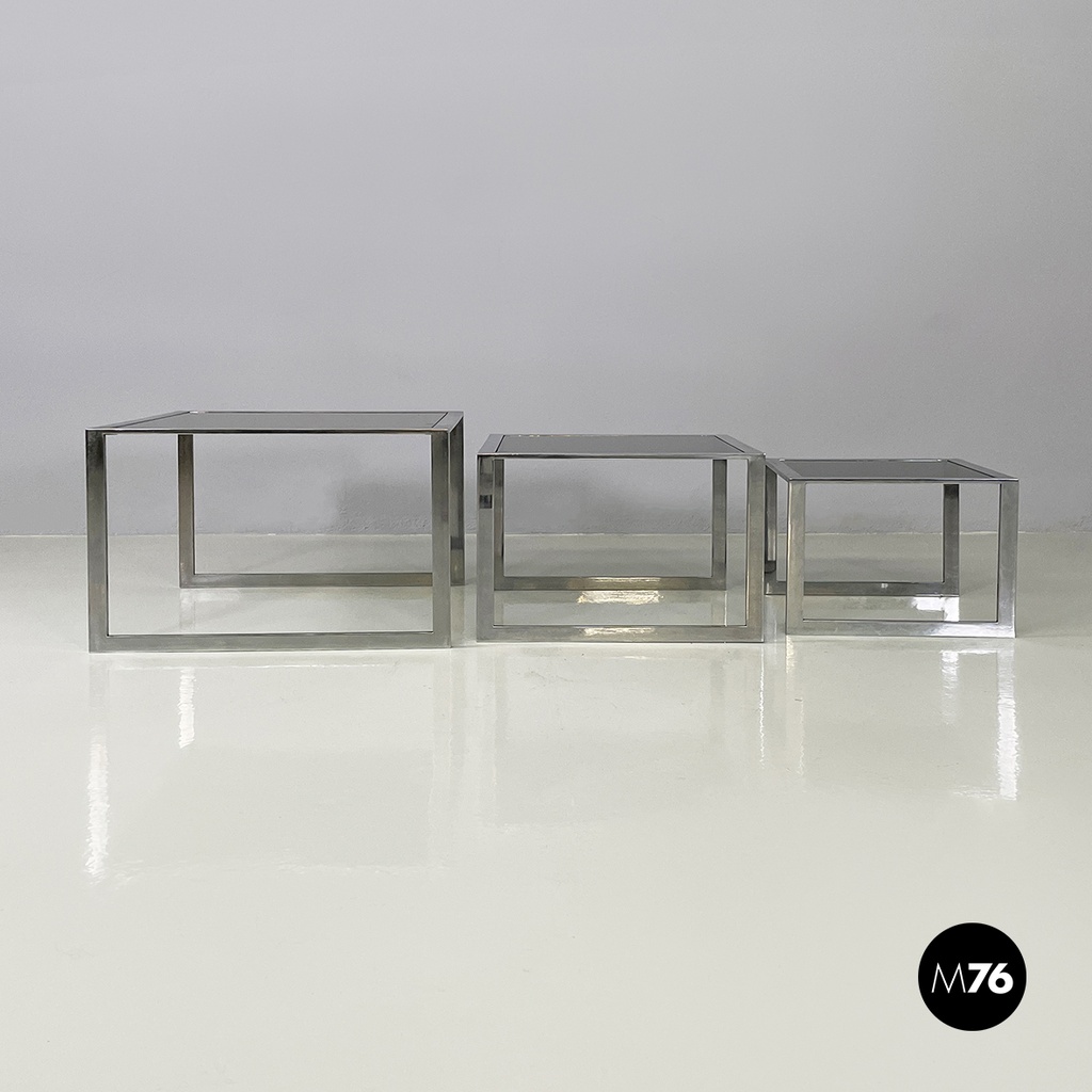 Italian modern Trio of coffee tables in smoked glass and metal, 1980s