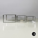 Italian modern Trio of coffee tables in smoked glass and metal, 1980s