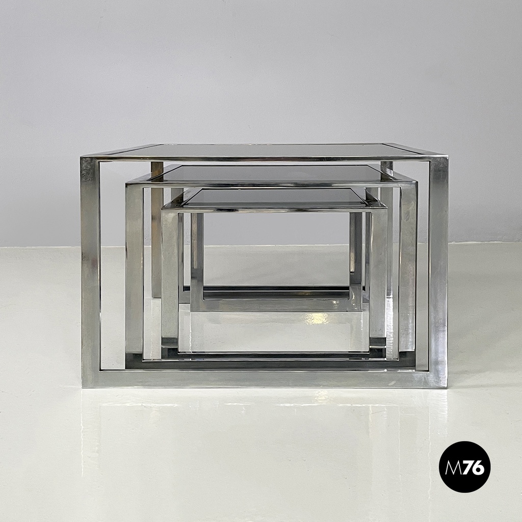 Italian modern Trio of coffee tables in smoked glass and metal, 1980s