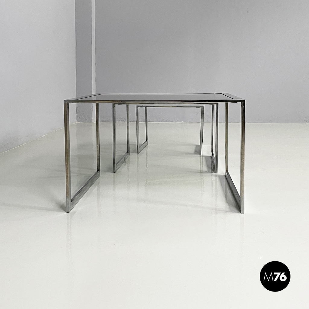 Italian modern Trio of coffee tables in smoked glass and metal, 1980s
