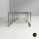 Italian modern Trio of coffee tables in smoked glass and metal, 1980s