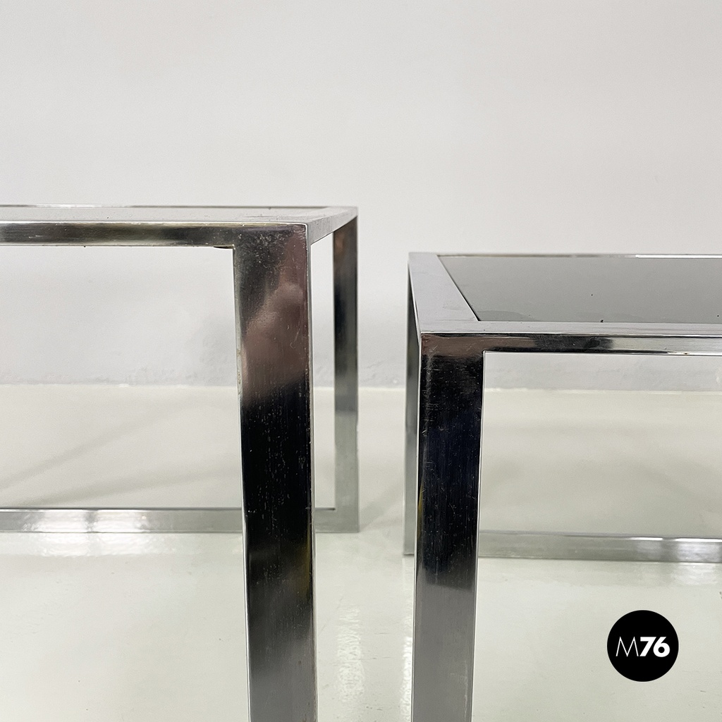 Italian modern Trio of coffee tables in smoked glass and metal, 1980s