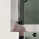 Italian modern Trio of coffee tables in smoked glass and metal, 1980s