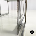 Italian modern Trio of coffee tables in smoked glass and metal, 1980s