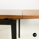 Italian mid-century modern Extendable dining table in wood and black metal 1960s