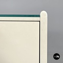 Italian post-modern white wood chest of drawers with black plastic handles 1980s