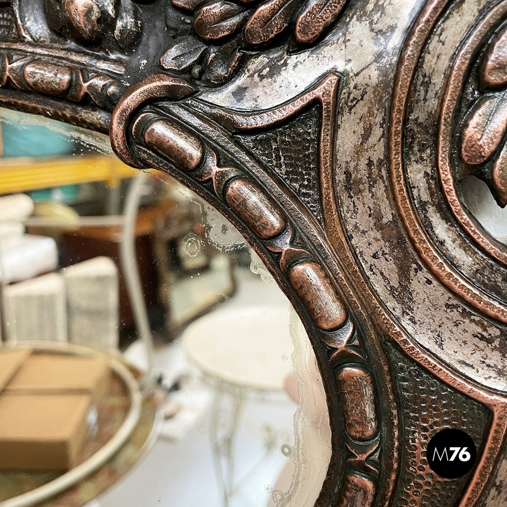 Italian finely crafted oval wall mirror in silvered copper, early 1900s