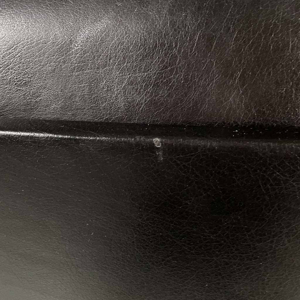 Poltrona da ufficio in pelle nera e metallo, 1980 ca.